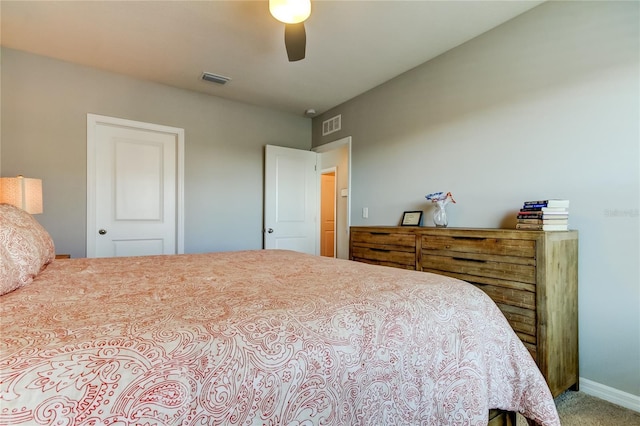 bedroom with carpet floors, ceiling fan, visible vents, and baseboards