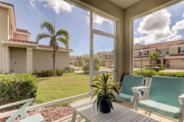 sunroom / solarium with a residential view