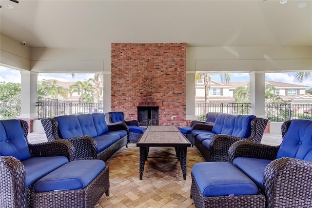 living room featuring an outdoor brick fireplace