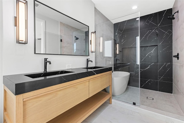 bathroom featuring double vanity, a sink, and walk in shower