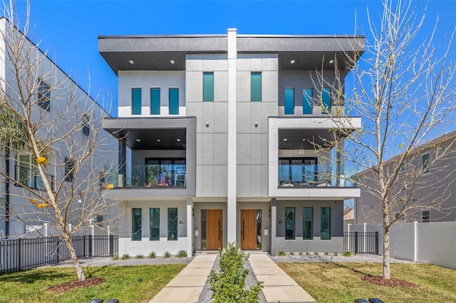 view of building exterior with fence