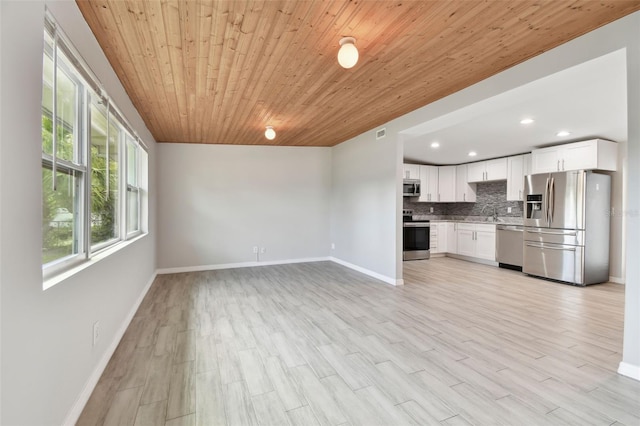 unfurnished living room with recessed lighting, visible vents, light wood-style floors, wooden ceiling, and baseboards