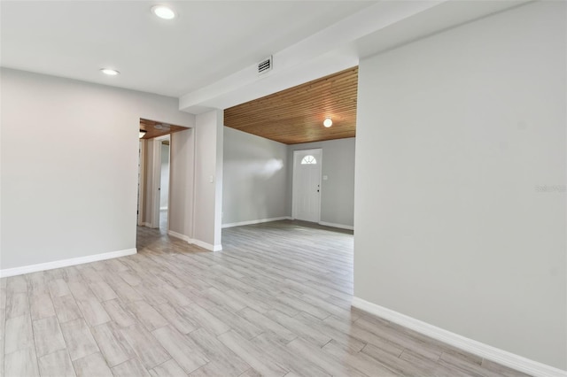 spare room featuring baseboards, visible vents, wood ceiling, light wood-style floors, and recessed lighting