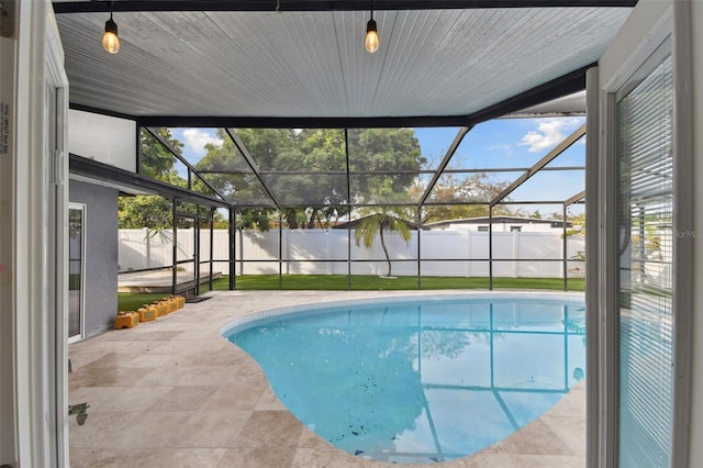 view of swimming pool with a lanai, a fenced backyard, a fenced in pool, and a patio