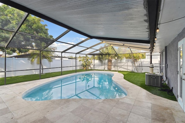 view of pool featuring a fenced in pool, a lawn, a fenced backyard, a patio area, and central AC