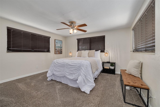 carpeted bedroom featuring a ceiling fan and baseboards