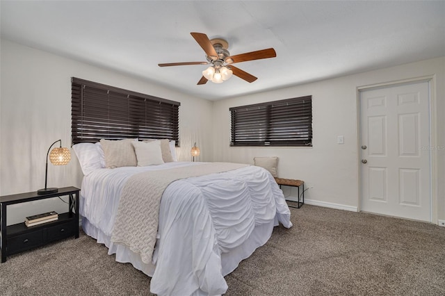 carpeted bedroom featuring a ceiling fan and baseboards