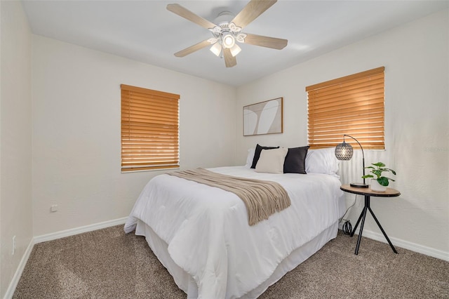 bedroom with ceiling fan, carpet floors, and baseboards