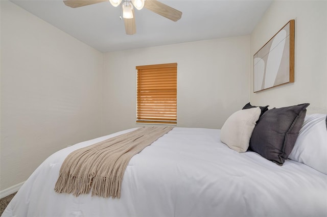 bedroom featuring baseboards and a ceiling fan