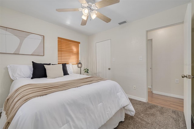 bedroom with ceiling fan, visible vents, baseboards, and carpet flooring