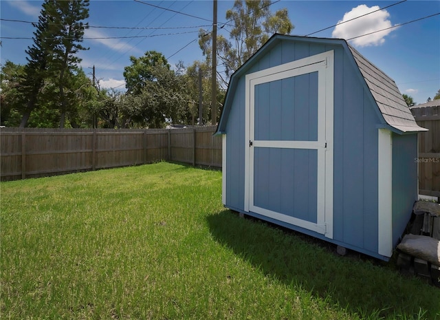 view of shed with a fenced backyard