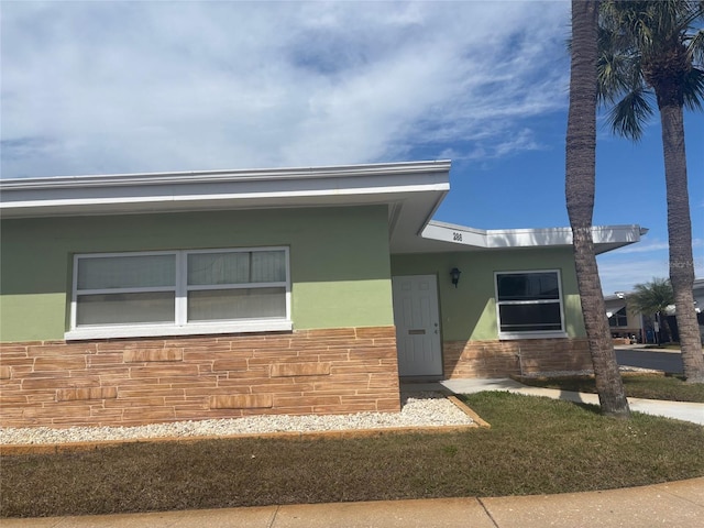 ranch-style house with stucco siding