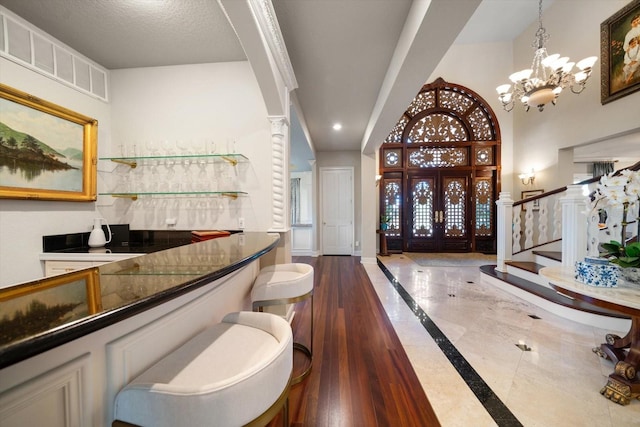 bar featuring recessed lighting, visible vents, baseboards, stairway, and indoor wet bar