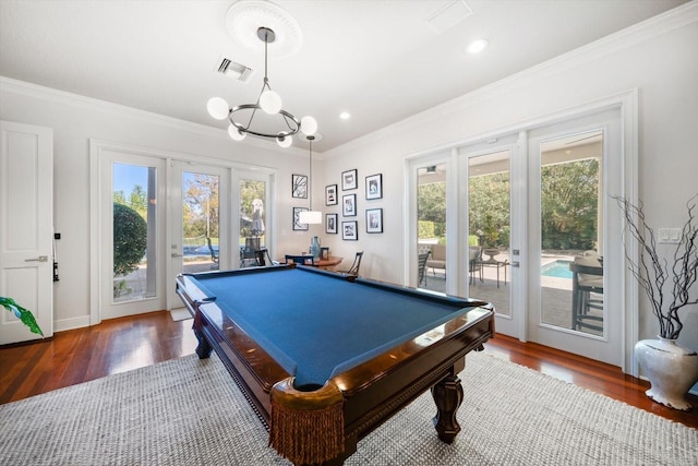 recreation room featuring ornamental molding, visible vents, and wood finished floors