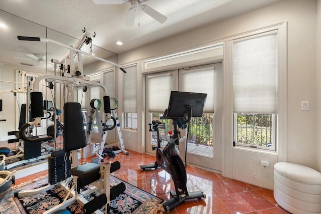 interior space featuring a textured ceiling, a ceiling fan, and recessed lighting