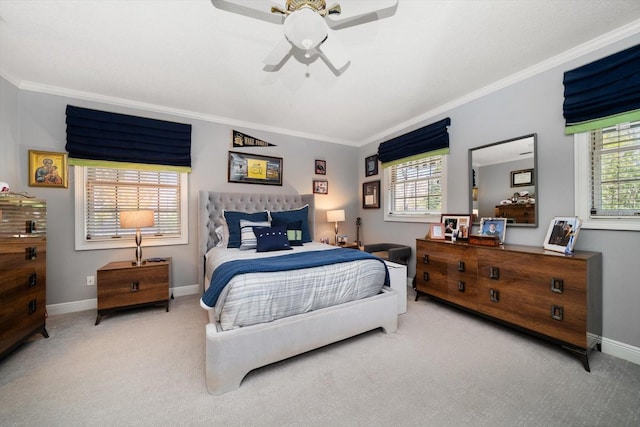 carpeted bedroom with baseboards, ornamental molding, and ceiling fan