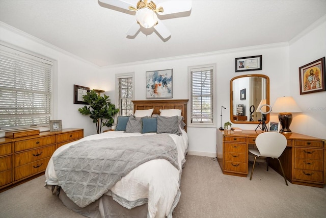 bedroom featuring a ceiling fan, light colored carpet, crown molding, and baseboards