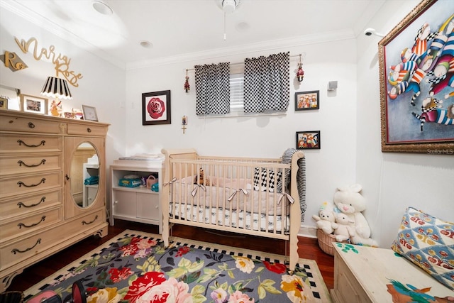 bedroom with ornamental molding and dark wood-type flooring