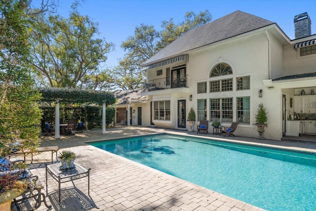 outdoor pool featuring a patio area