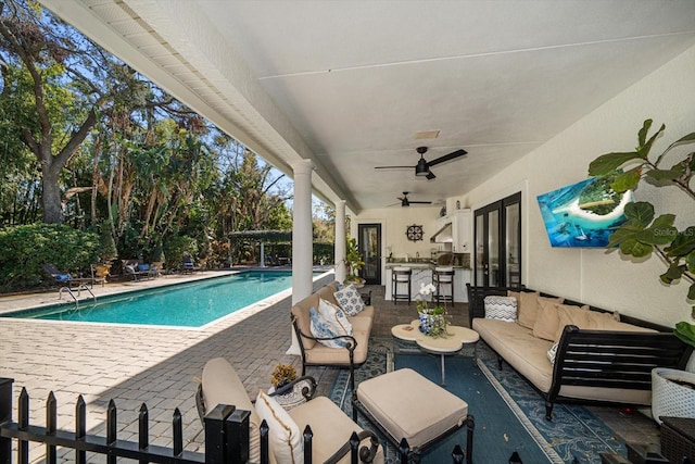 outdoor pool featuring ceiling fan, a patio, french doors, and an outdoor living space