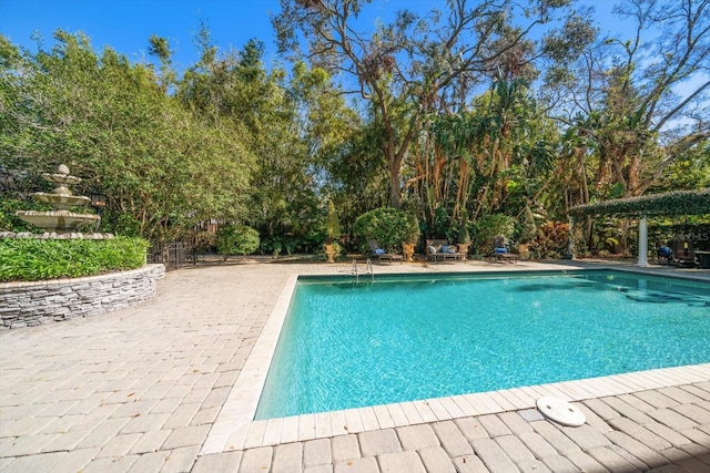 pool featuring a patio area