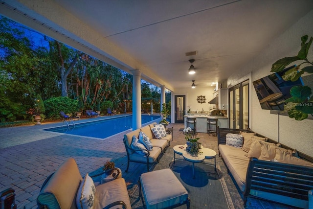 view of patio with an outdoor hangout area, a ceiling fan, visible vents, french doors, and an outdoor pool