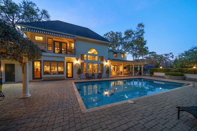 pool with a patio area