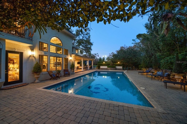 pool featuring a patio area