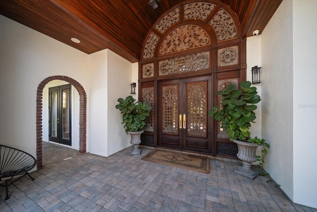 doorway to property with french doors and stucco siding