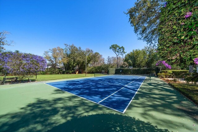 view of tennis court with fence