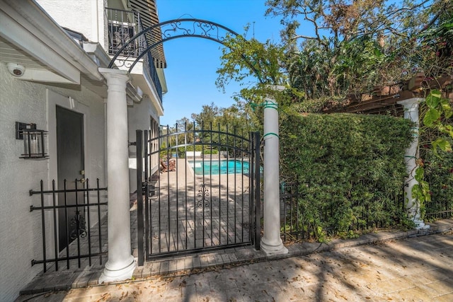 view of gate featuring fence