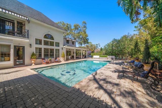 outdoor pool featuring a patio area