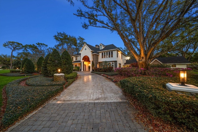 view of front of property featuring decorative driveway