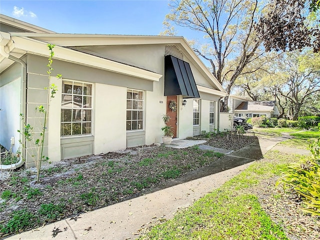 view of front of home featuring stucco siding