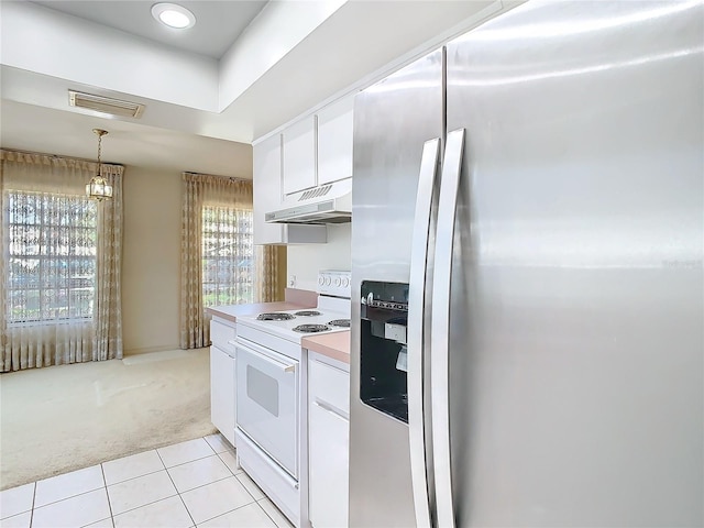 kitchen with white electric range oven, visible vents, white cabinetry, stainless steel fridge, and under cabinet range hood