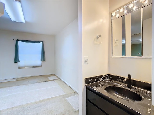 bathroom featuring vanity and baseboards