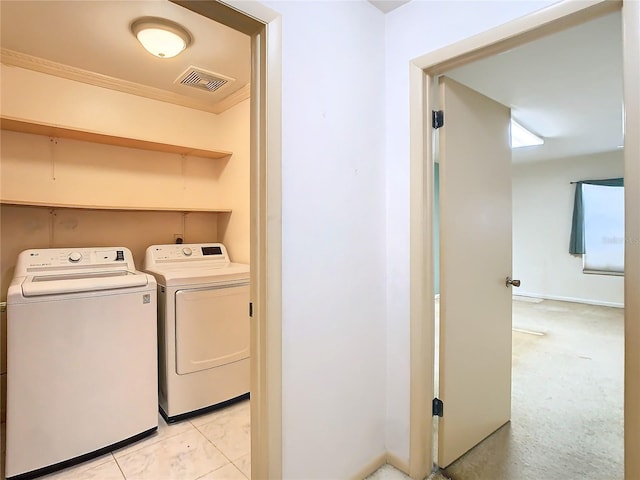 washroom with laundry area, crown molding, visible vents, and washer and dryer