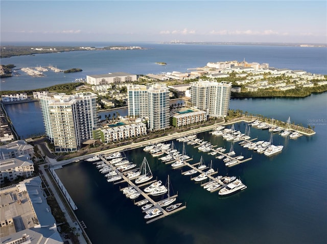 birds eye view of property featuring a water view and a city view