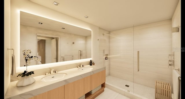 bathroom with radiator, double vanity, a tile shower, and a sink