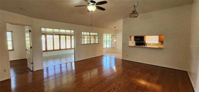 11722 Currie Ln Unit E1, Largo, FL 33774 - spare room featuring a ceiling fan, wood finished floors, and baseboards