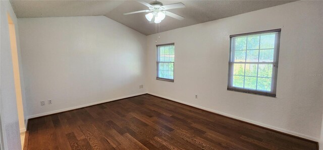 11722 Currie Ln Unit E1, Largo, FL 33774 - unfurnished room featuring dark wood-style floors, ceiling fan, vaulted ceiling, and baseboards