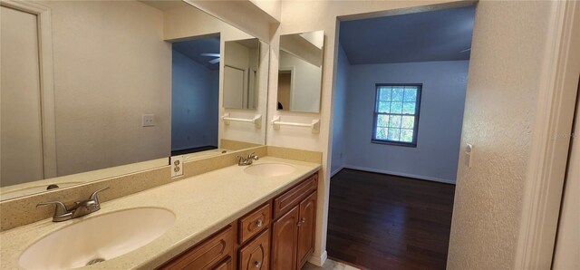 11722 Currie Ln Unit E1, Largo, FL 33774 - full bath with double vanity and wood finished floors