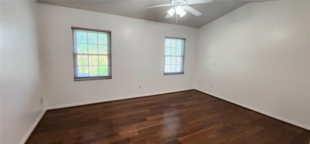 11722 Currie Ln Unit E1, Largo, FL 33774 - unfurnished room with healthy amount of natural light, dark wood-type flooring, lofted ceiling, ceiling fan, and baseboards