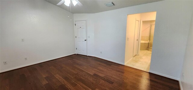 11722 Currie Ln Unit E1, Largo, FL 33774 - unfurnished room with ceiling fan, wood finished floors, and baseboards
