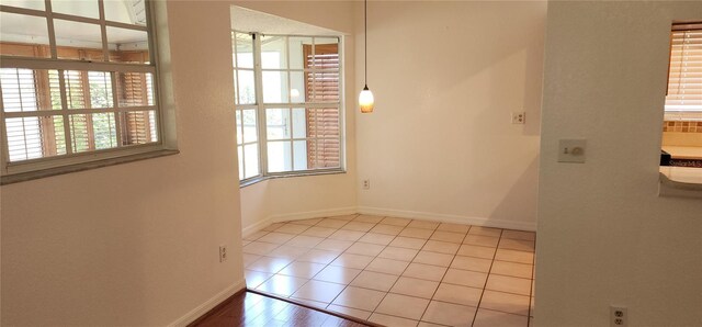 11722 Currie Ln Unit E1, Largo, FL 33774 - spare room with baseboards and tile patterned flooring