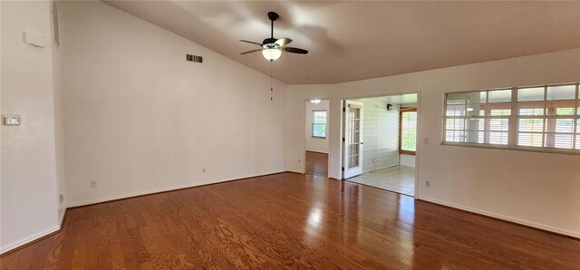 11722 Currie Ln Unit E1, Largo, FL 33774 - empty room featuring a ceiling fan, wood finished floors, lofted ceiling, and baseboards