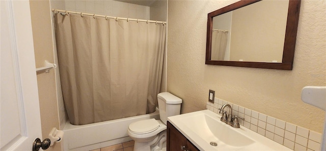 11722 Currie Ln Unit E1, Largo, FL 33774 - full bathroom featuring a textured wall, toilet, shower / bath combination with curtain, vanity, and tasteful backsplash