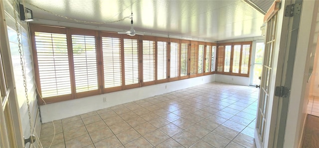 11722 Currie Ln Unit E1, Largo, FL 33774 - unfurnished sunroom featuring tile patterned flooring