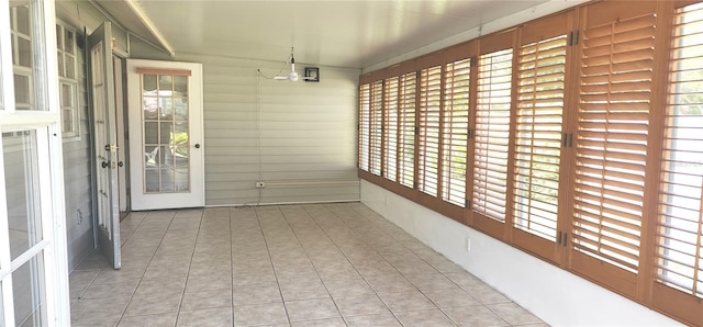 11722 Currie Ln Unit E1, Largo, FL 33774 - unfurnished sunroom with plenty of natural light