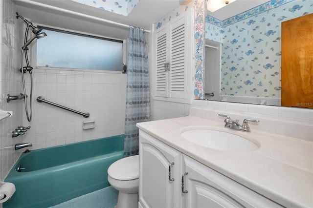 bathroom with shower / tub combo, vanity, toilet, and wallpapered walls